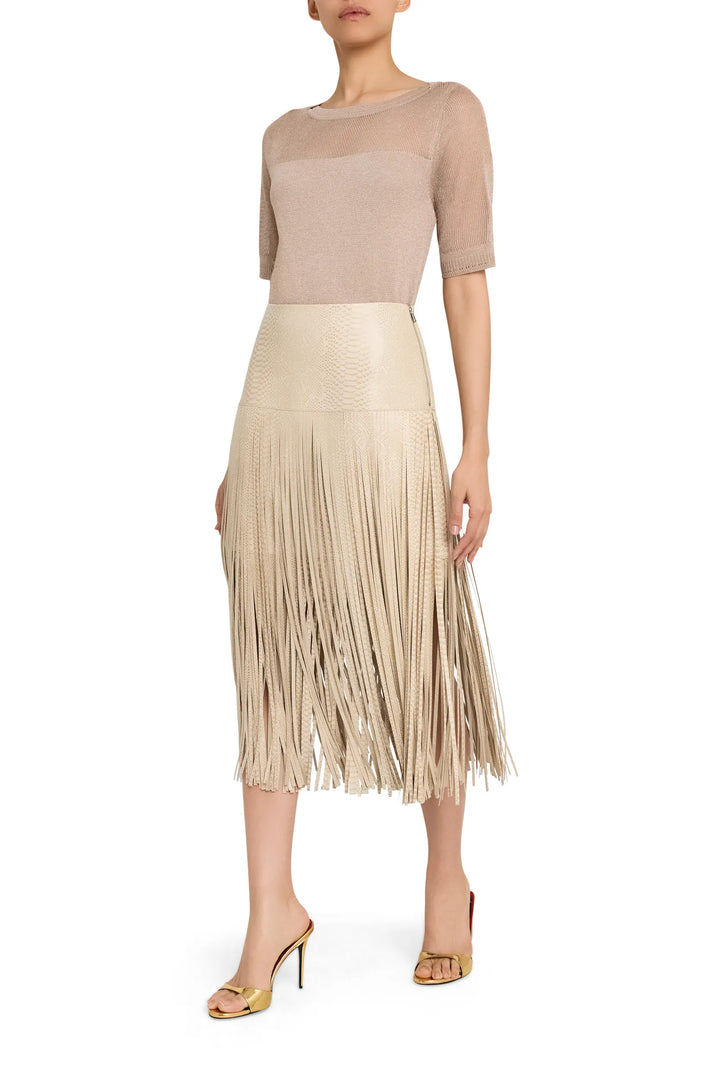High-waisted leather skirt with fringe trim, fitted silhouette, paneled construction; front view on white.