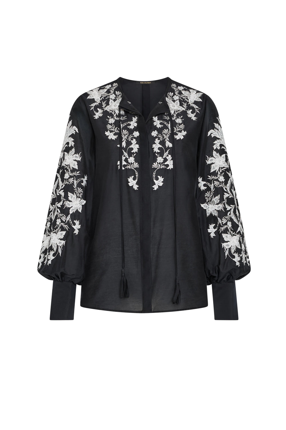 Black blouse with white floral embroidery on a white background