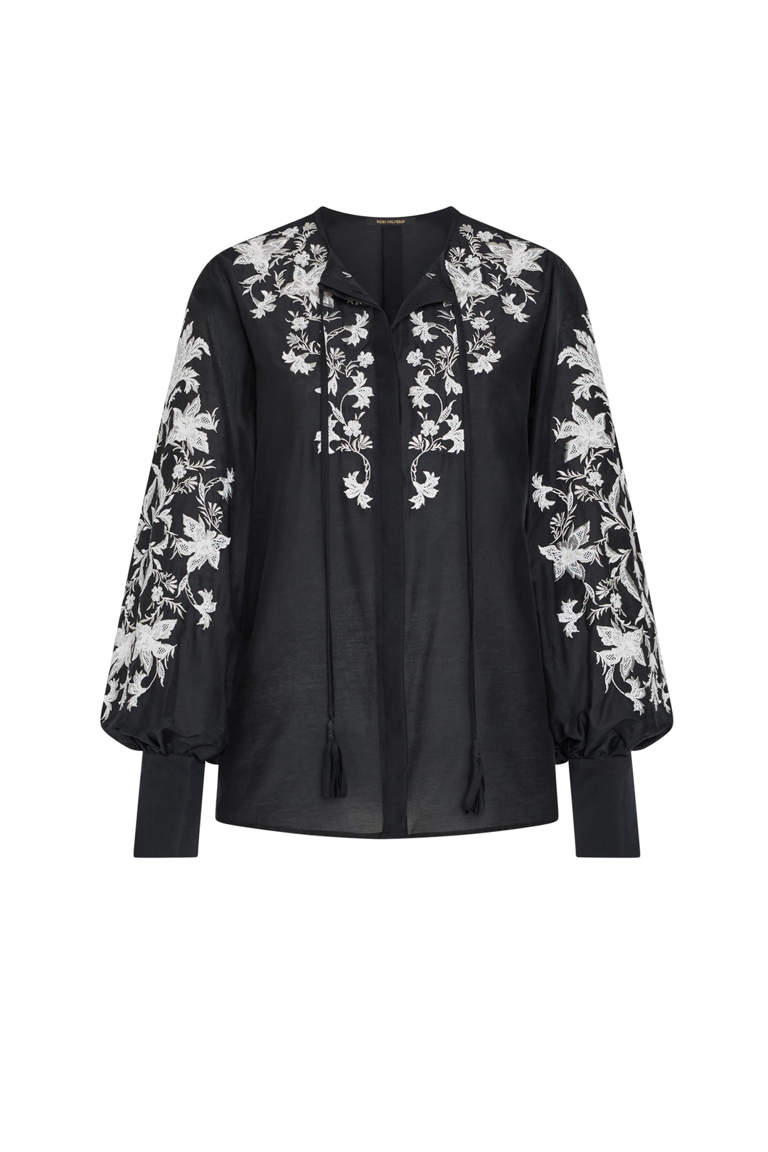 Black blouse with white floral embroidery on a white background