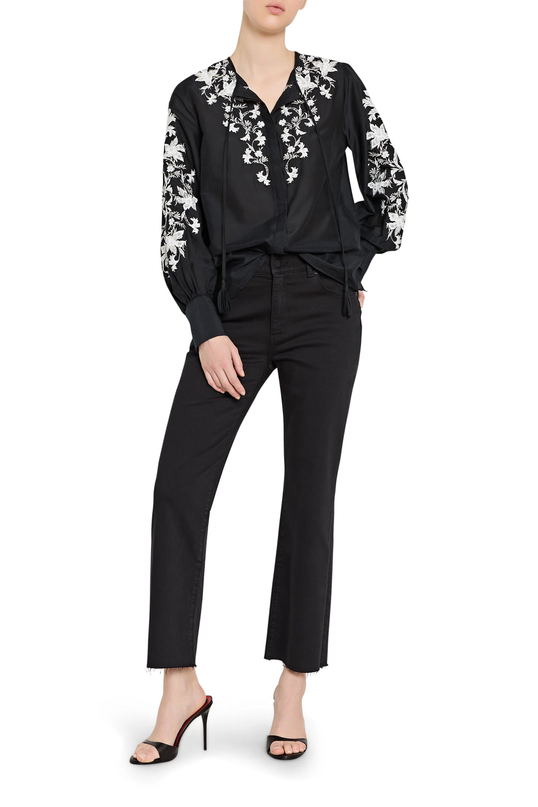 Black outfit with floral embroidery on a white background