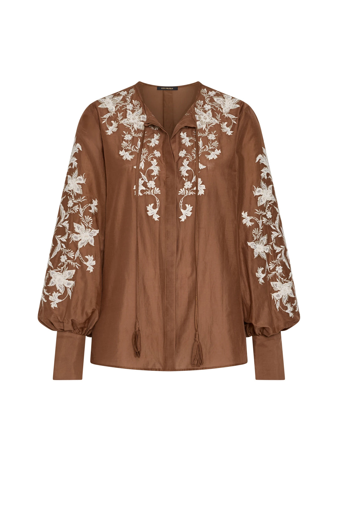Cotton blouse with floral embroidery, tie neckline, relaxed fit silhouette. Front view on white.