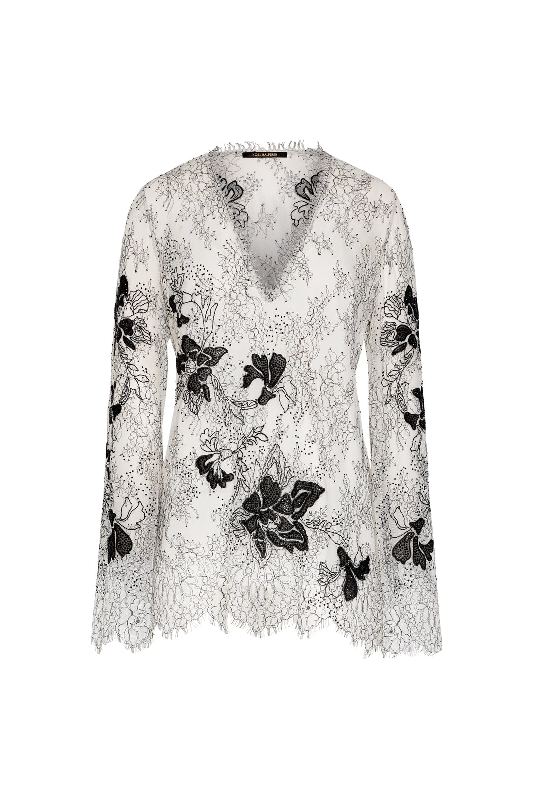 Lace top with black floral embroidery on a white background