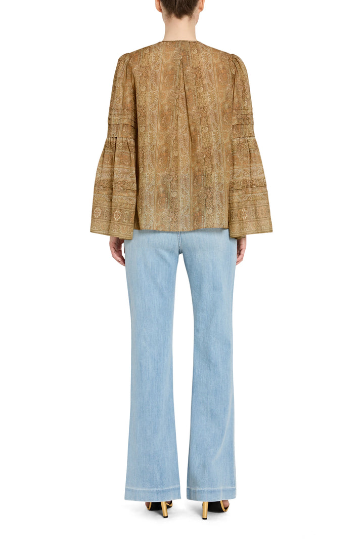 Relaxed-fit blouse with allover print, long sleeves, and back yoke. Back view on model.