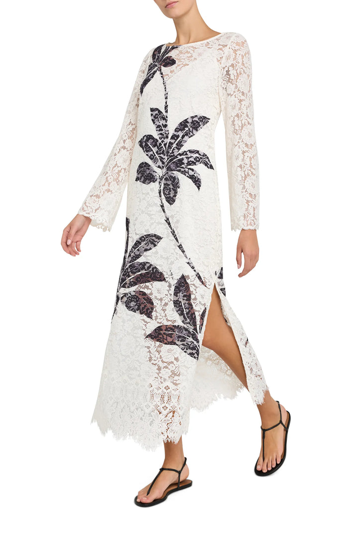 Maxi dress with sheer lace, side slit, allover botanical print; fluid silhouette. Front view on model.