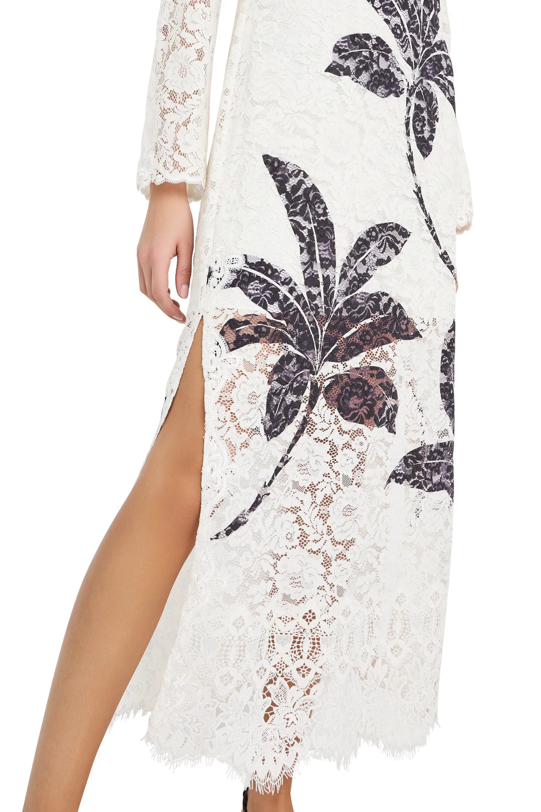 Maxi dress with long sleeves, high side slit, allover botanical print, fluid silhouette; front view on model.