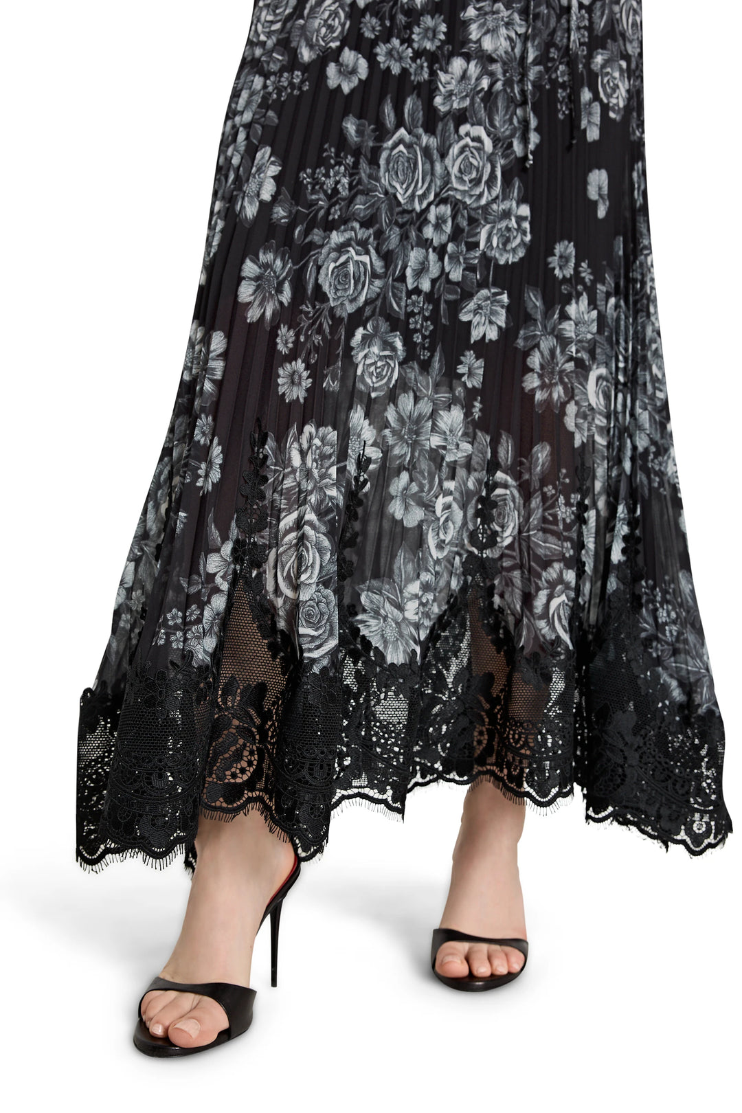 Black lace dress with floral patterns on a white background