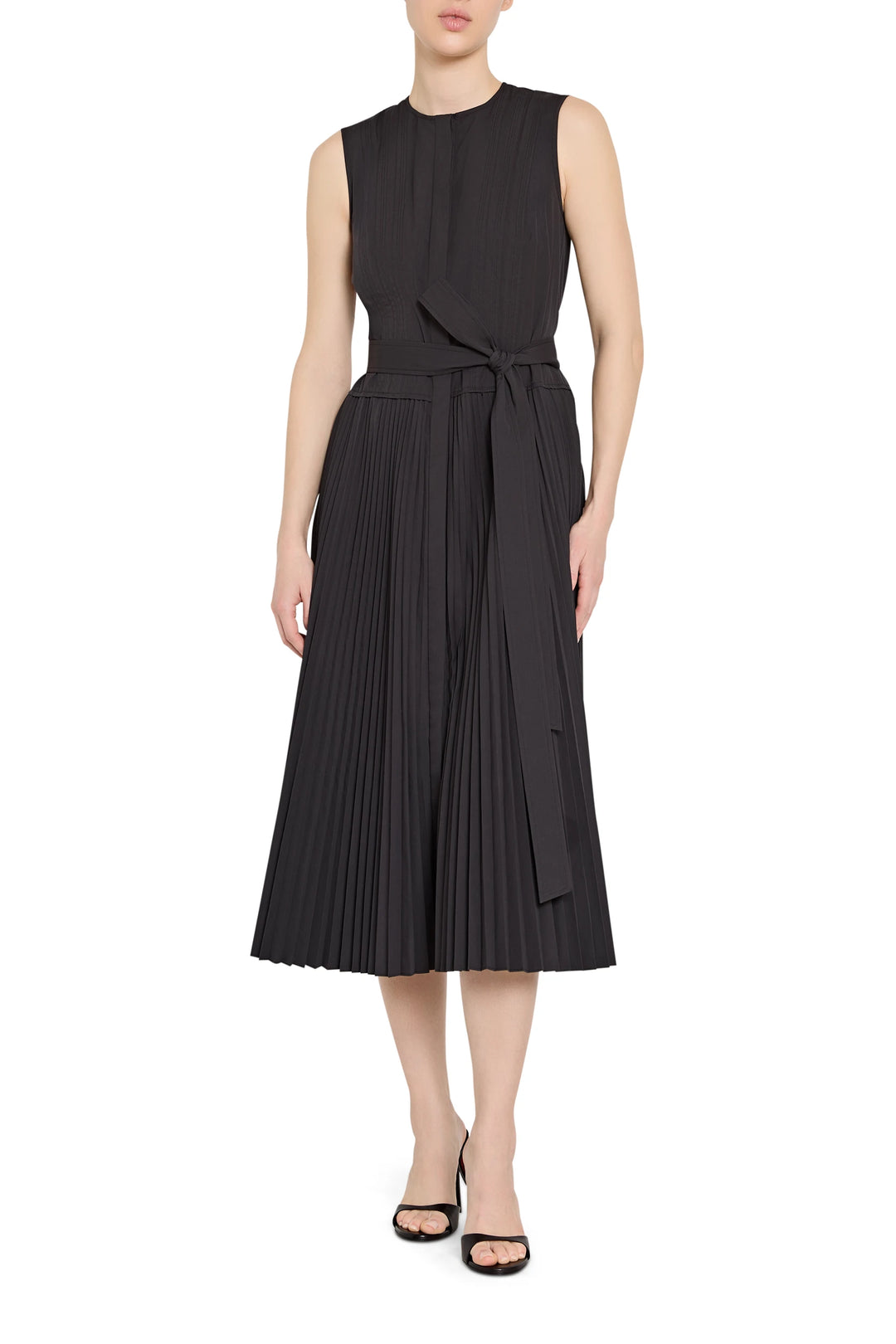 Black sleeveless dress with a belt worn by a model on a white background