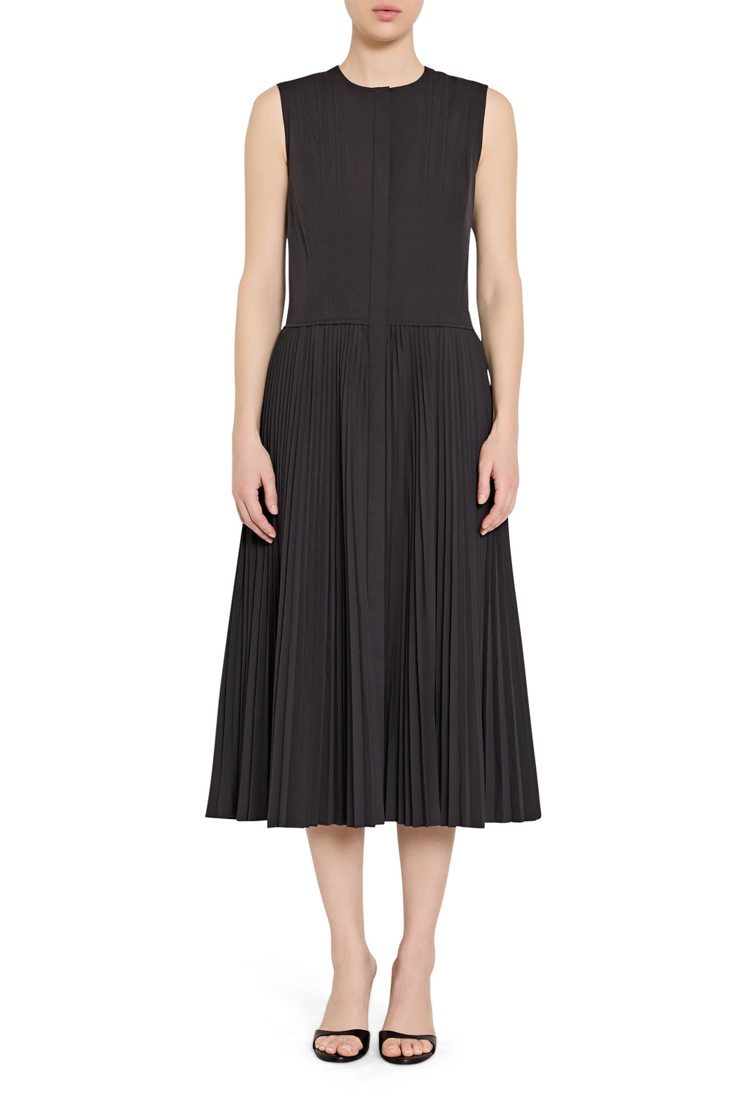 Black sleeveless dress worn by a model on a white background