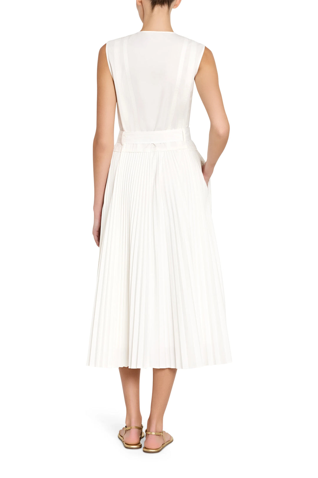 White pleated dress worn by a model on a white background