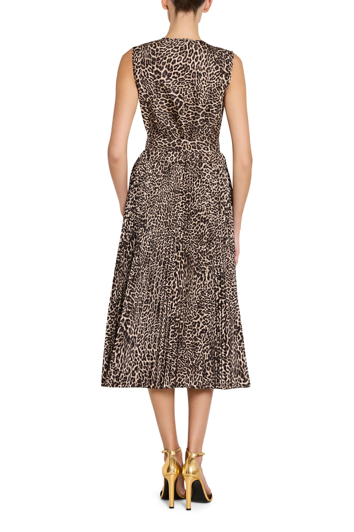 Sleeveless midi dress with fitted bodice and flared skirt in Stella Leopard fabric, open-back cut. Back view on model.