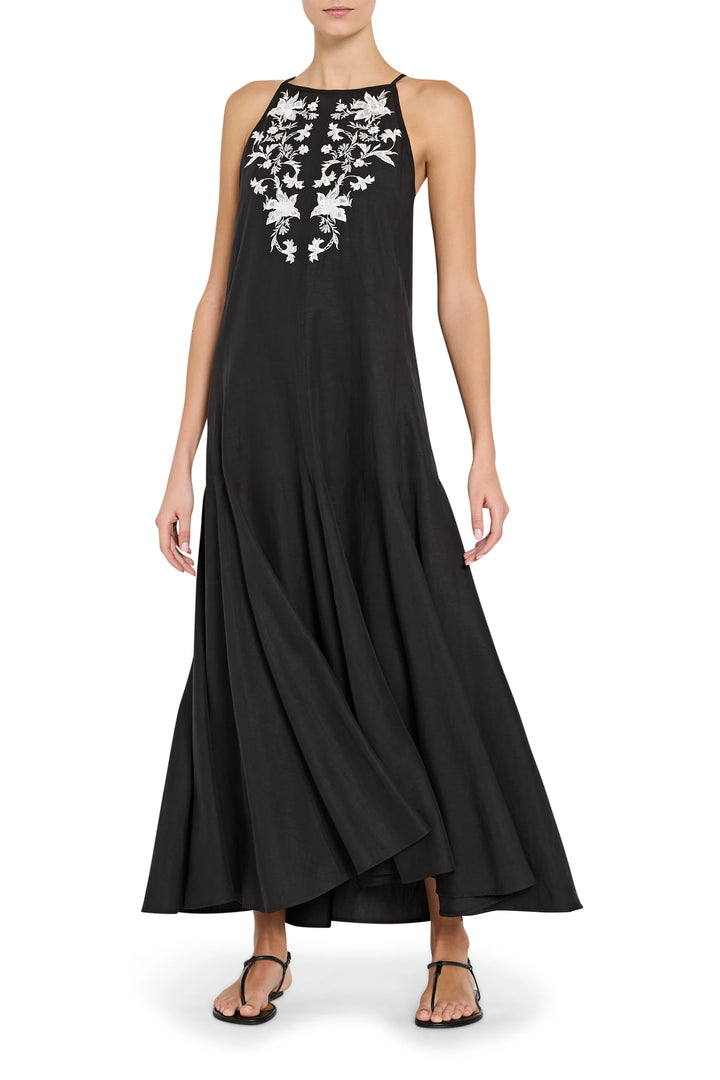 Black sleeveless dress with white floral embroidery on a white background