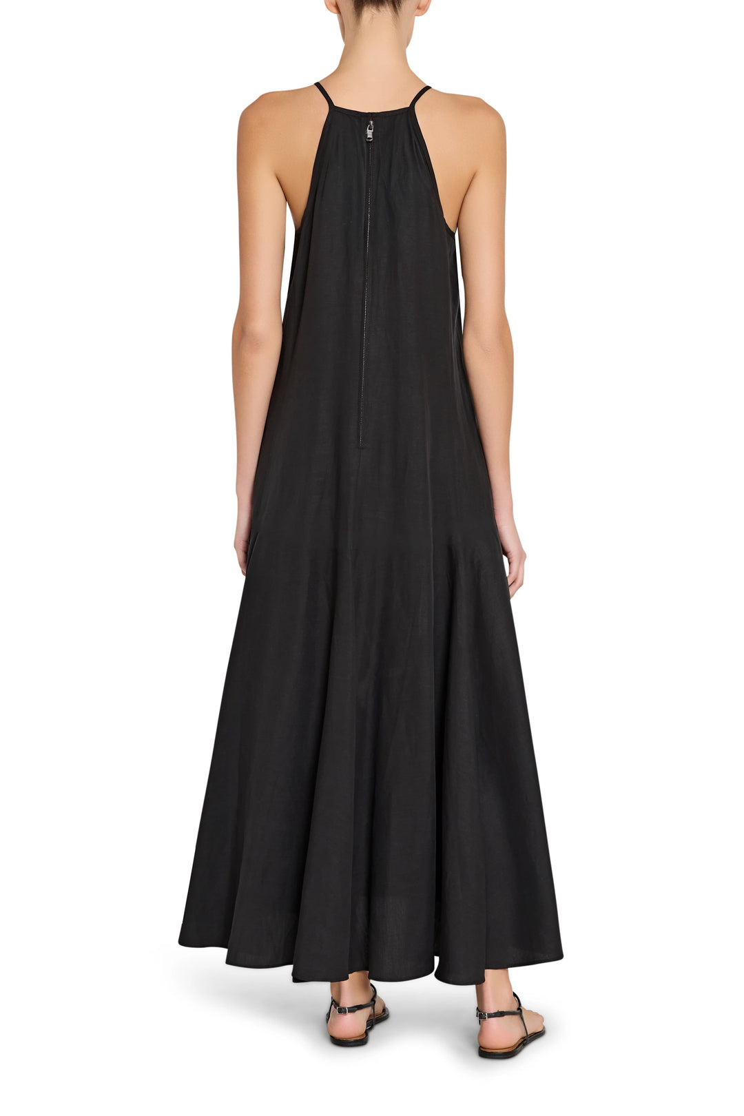 Black halter neck dress worn by a person on a white background