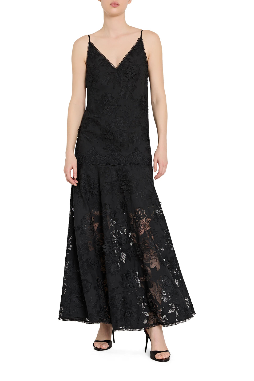 Black lace dress worn by a model on a white background
