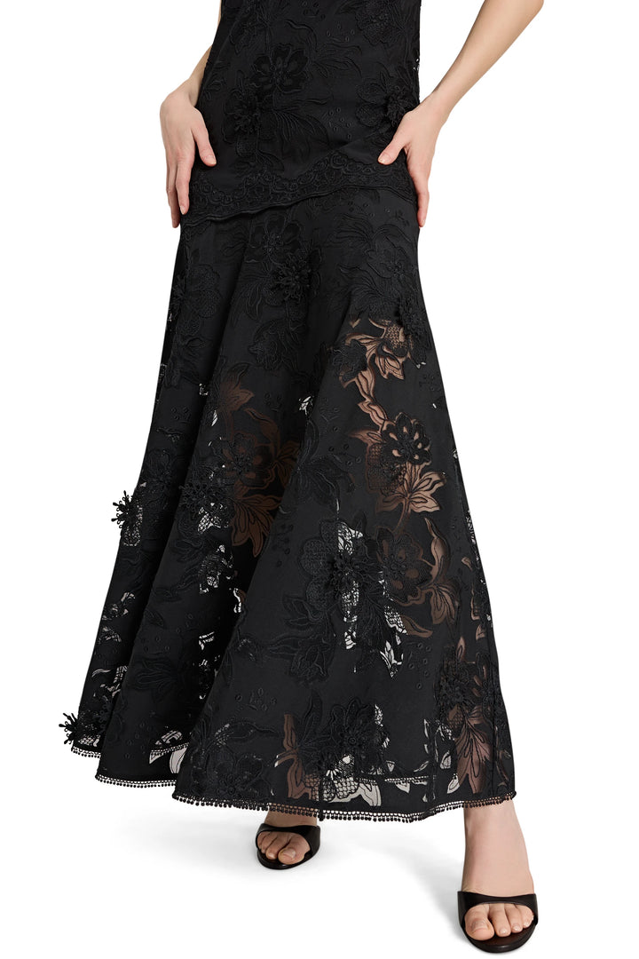 Black lace pants worn by a person on a white background