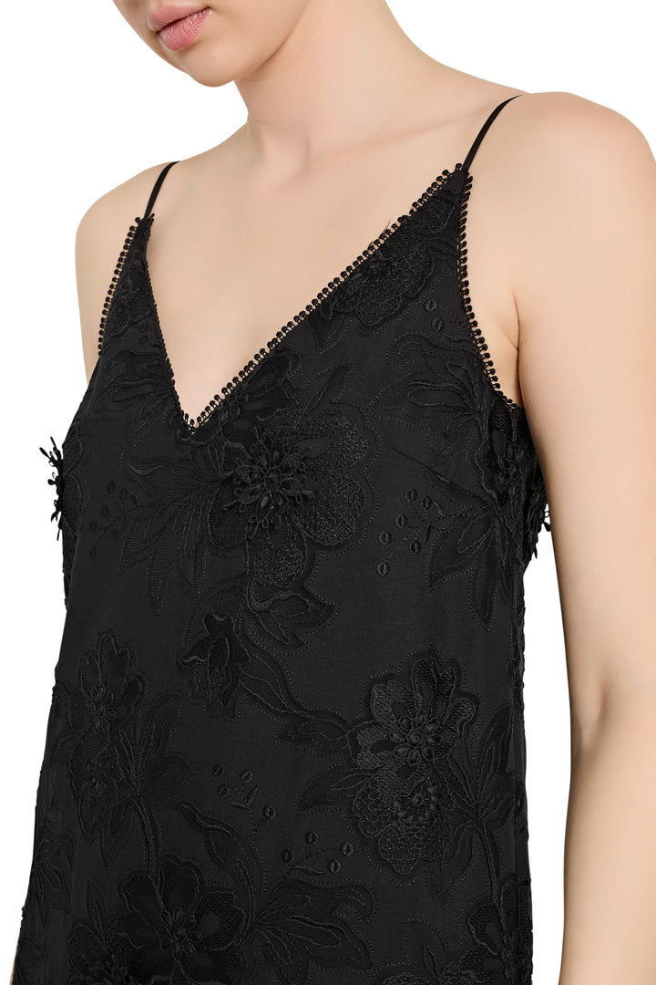 Black lace dress with floral details on a white background