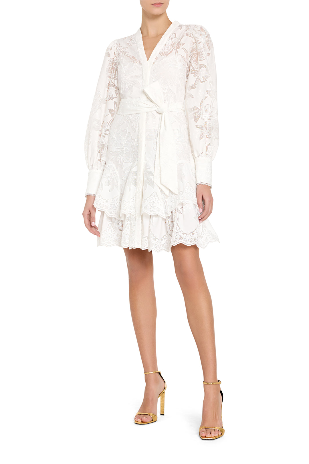 White lace dress worn by a model on a white background