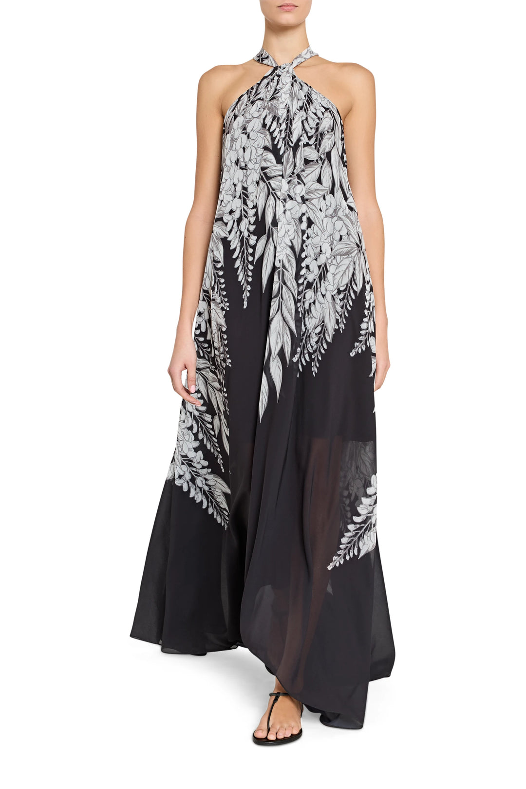 Black and white floral halter neck gown on a white background