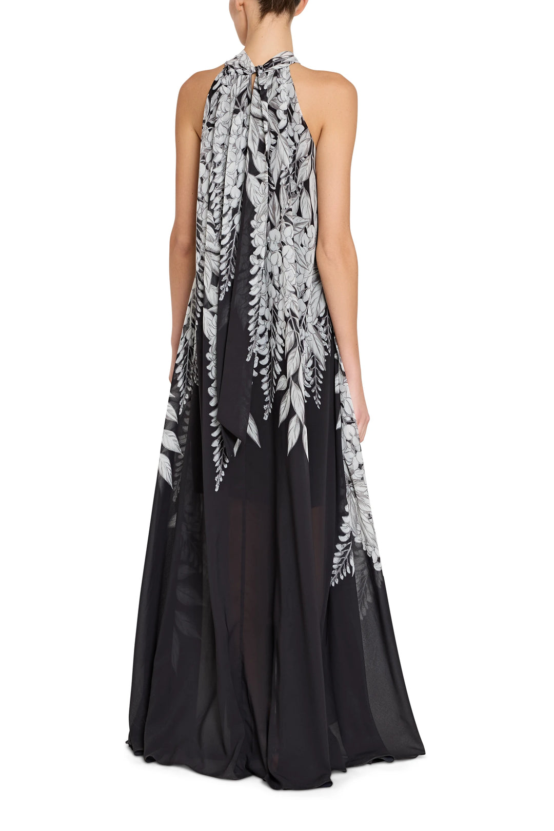 Black and white floral halter neck gown on a white background