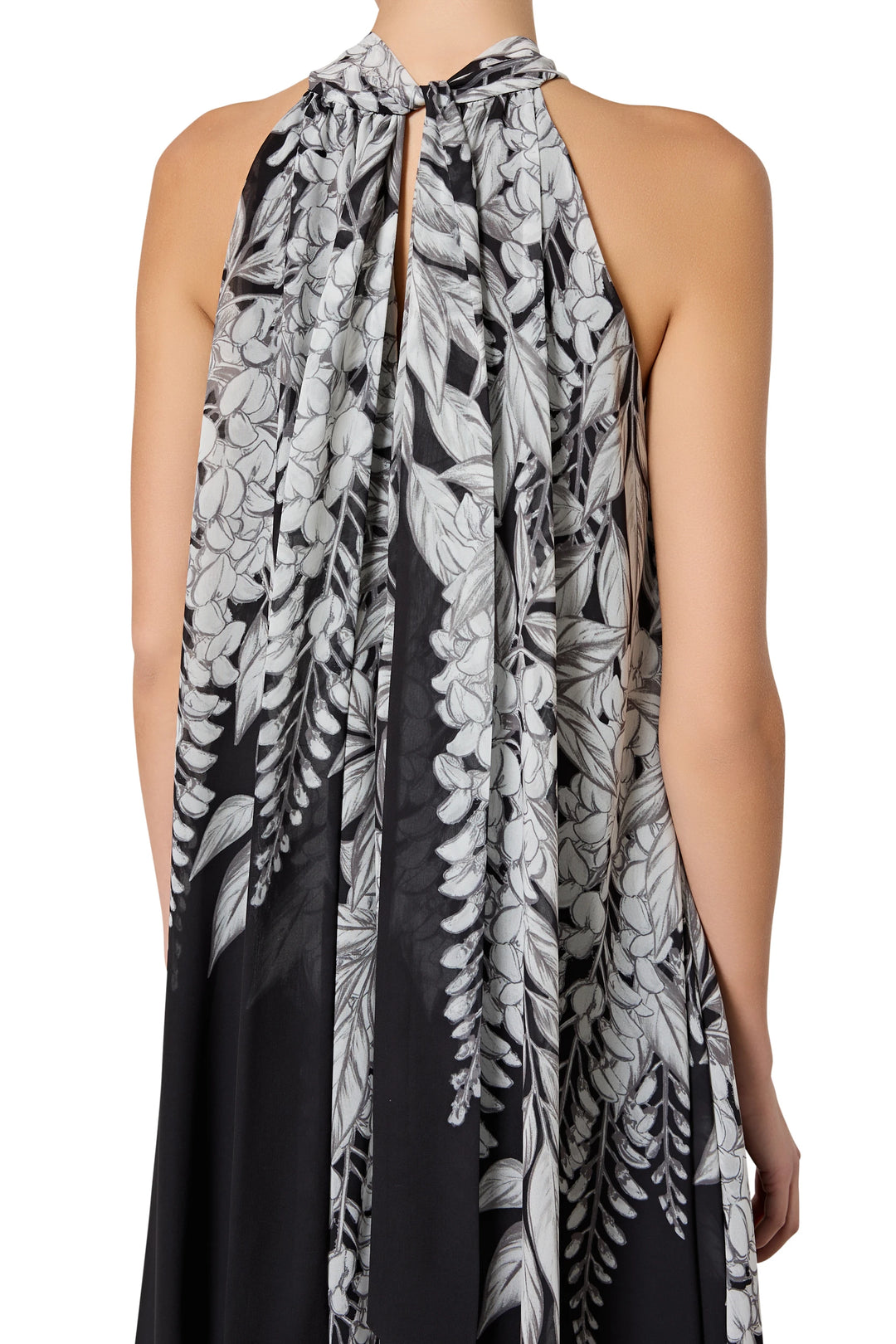 Black and white floral halter dress on a white background