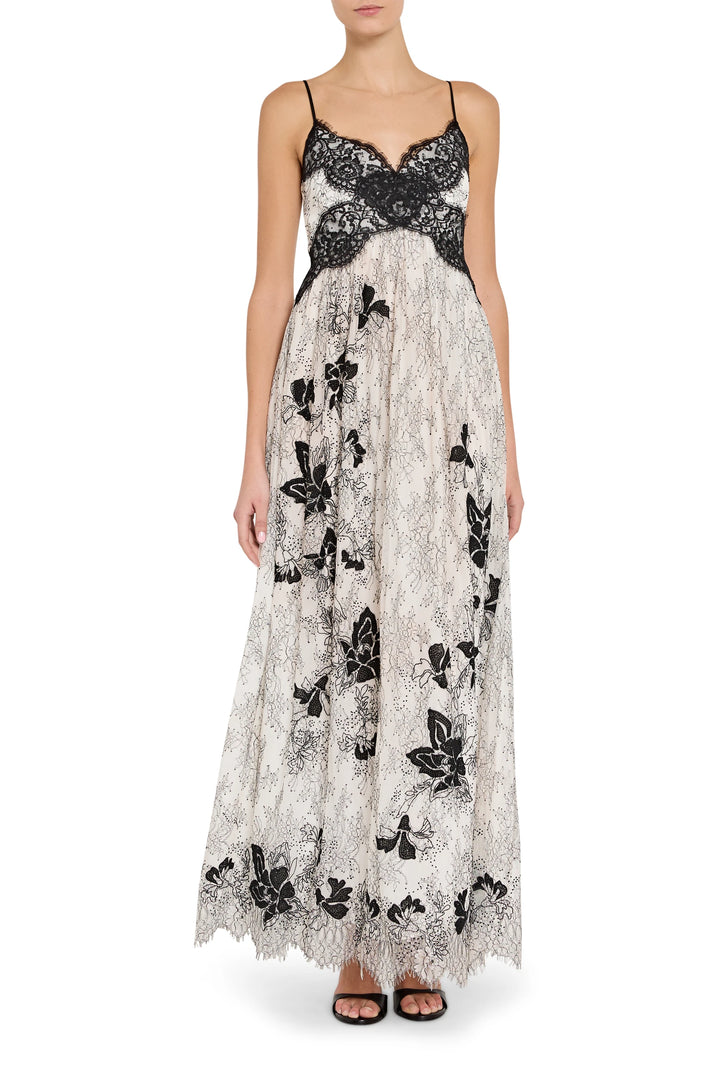 Long black and white floral lace dress on a white background
