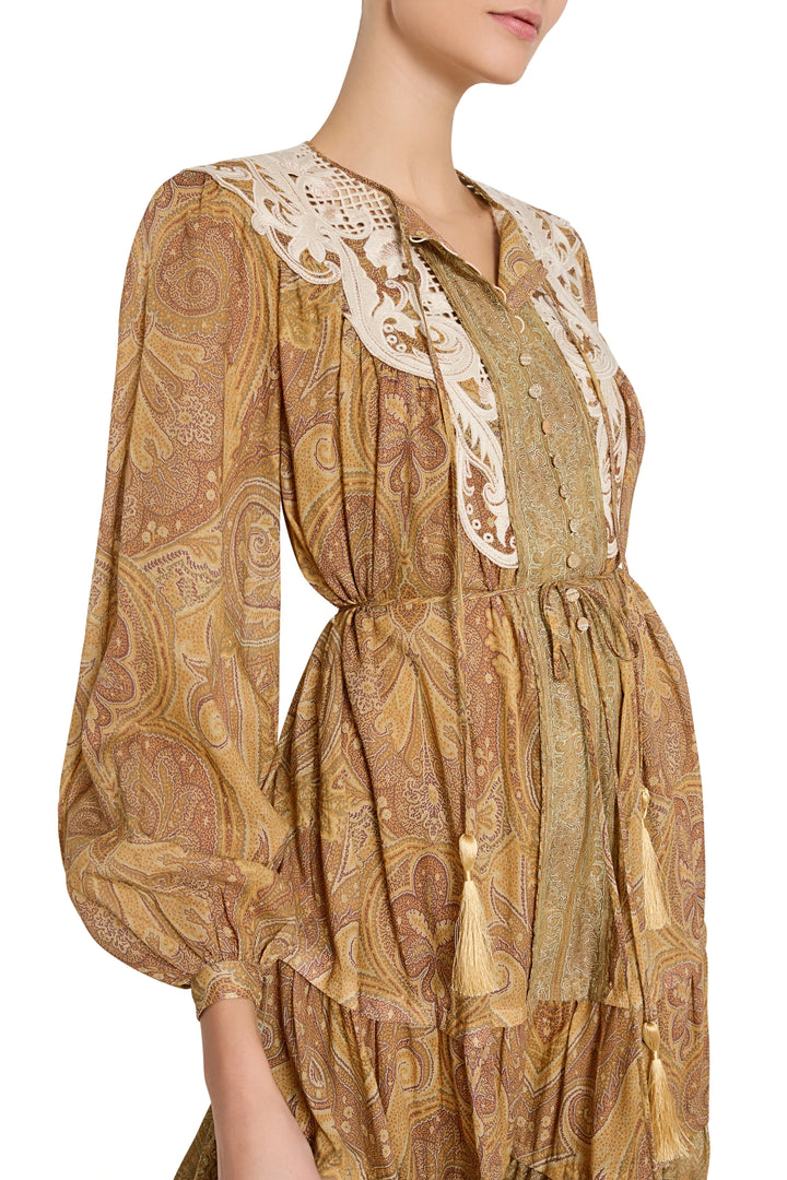 A-line dress with long sleeves, lace collar, hand-embroidered details, tassel ties; front view on model.