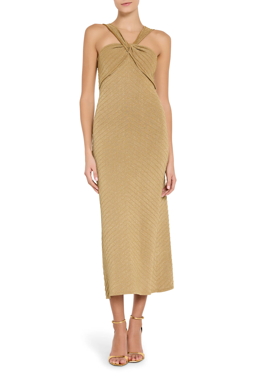 Woman wearing a gold dress on a white background