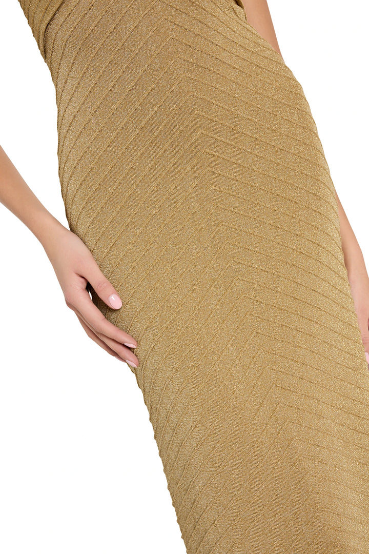 Close-up of a beige ribbed dress on a white background