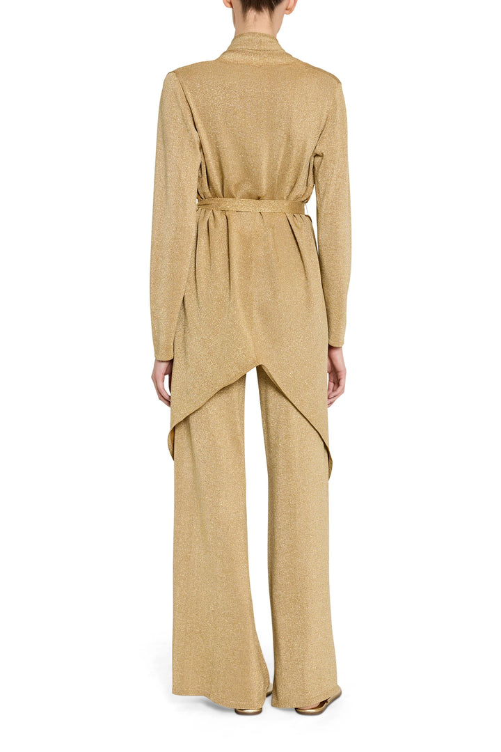 Beige jumpsuit worn by a person on a white background