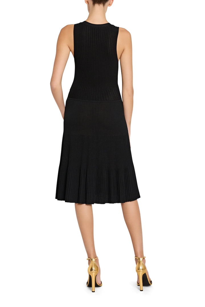 Black sleeveless dress worn by a model on a white background