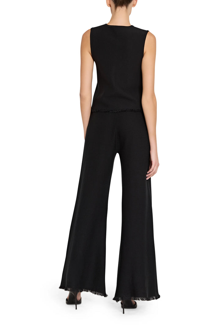 Black sleeveless top and wide-leg pants on a white background