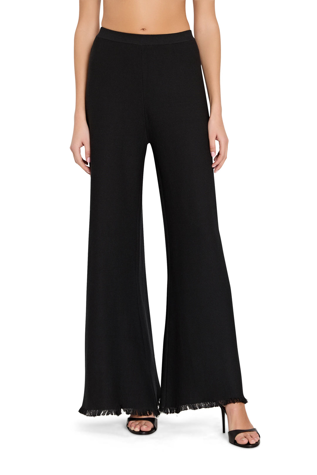 Black wide-leg pants worn by a person on a white background