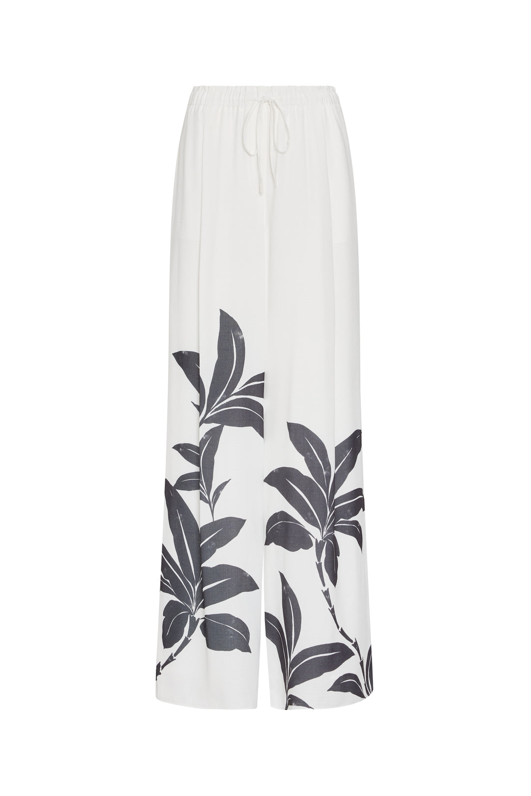 White pants with black leaf pattern on a white background