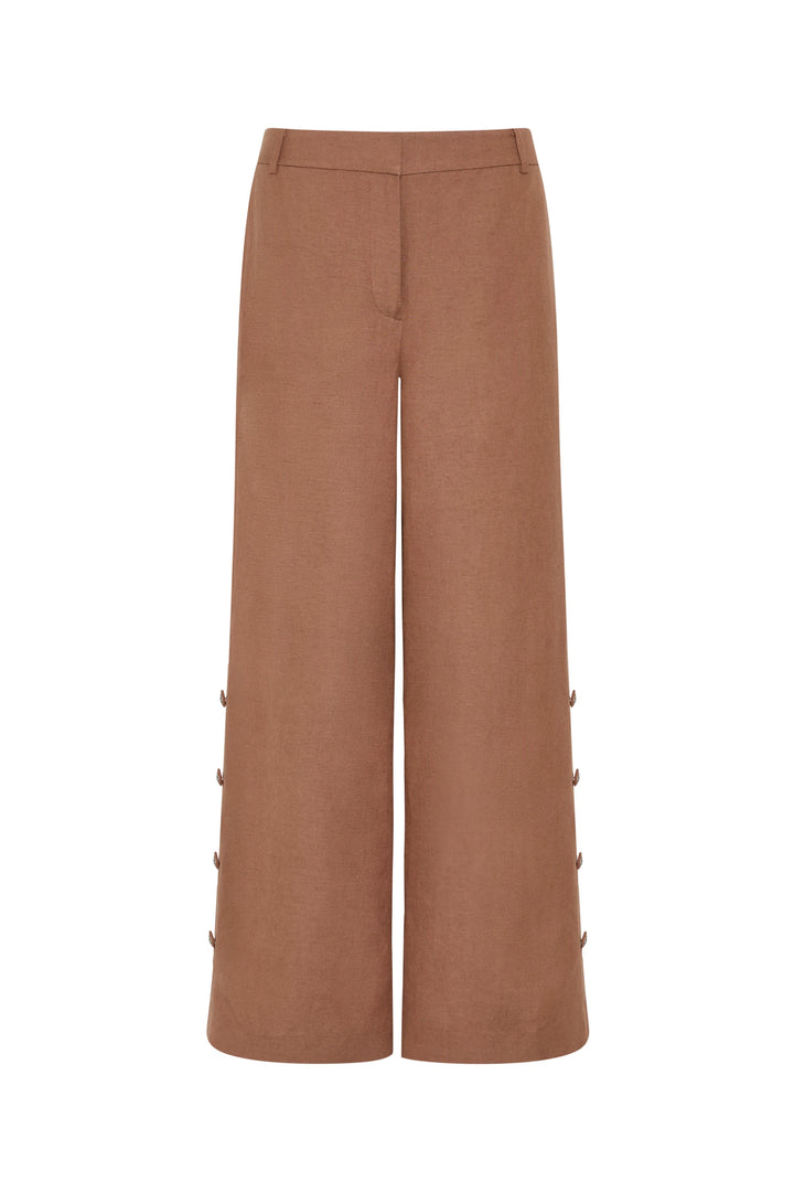 Wide-leg, high-waisted linen pant with artisan buttons and structured waistband. Front view on white.