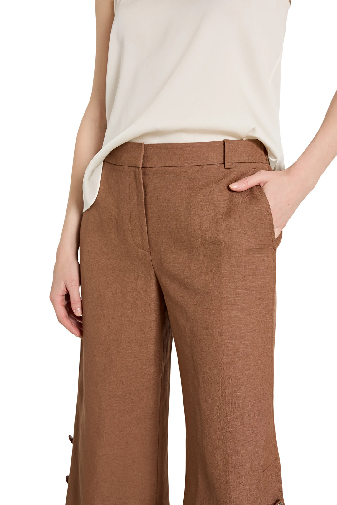 Wide-leg linen pant with elastic back waistband and relaxed silhouette, side seam pockets; front view on model.