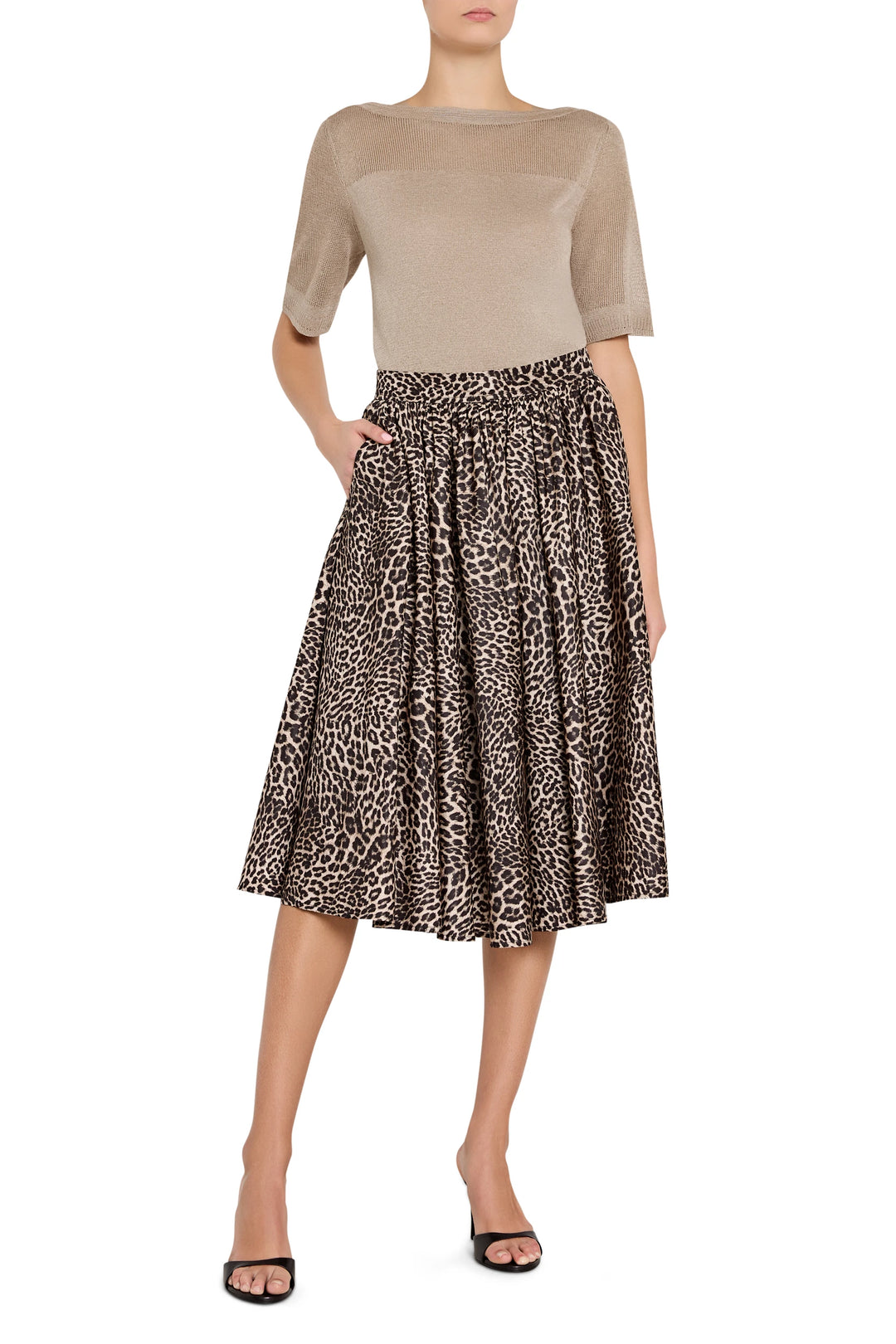 Knee-length skirt with a straight silhouette in lightweight fabric, subtle leopard pattern; front view on model.