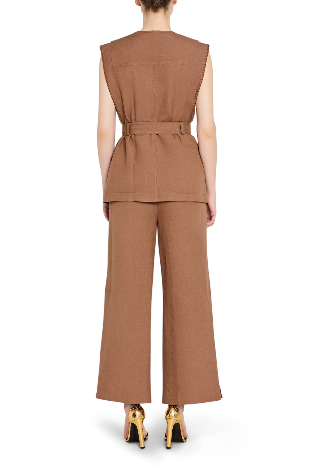 Sleeveless linen vest with belted waist and clean back, tailored silhouette; back view on model.
