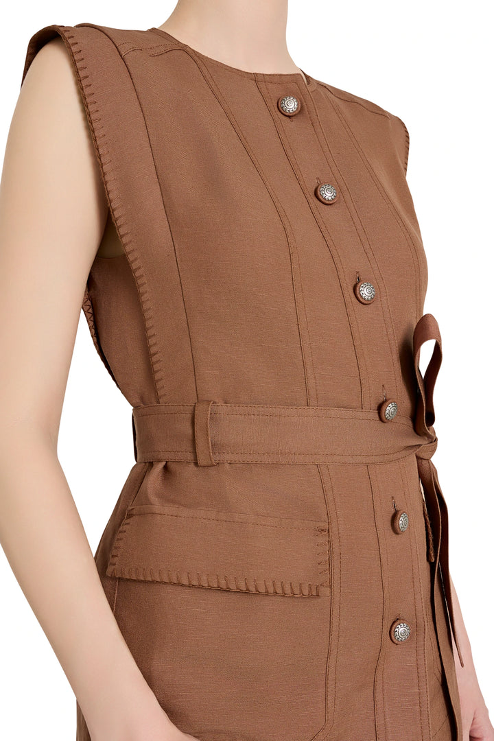 Sleeveless linen-blend vest with front buttons and patch pockets, belted waist. Front view on model.