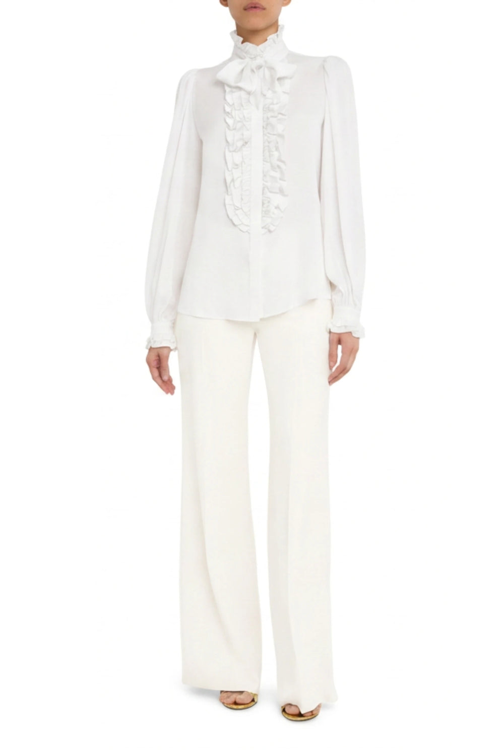 Silk blouse with ruffled front, long sleeves, relaxed fit; front view on model.