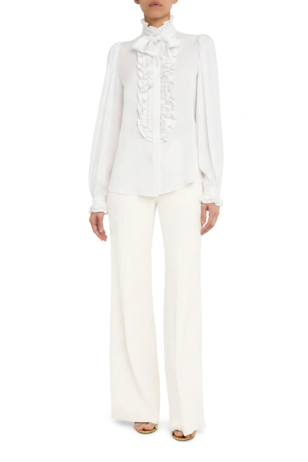 Silk blouse with ruffled front, long sleeves, relaxed fit; front view on model.