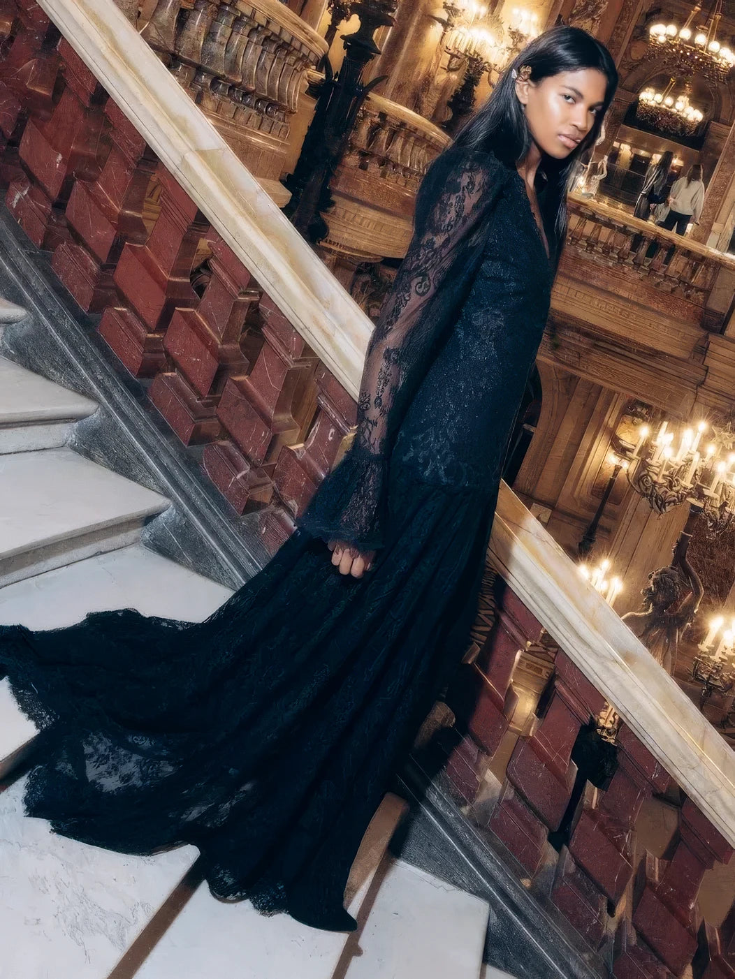 Black Chantilly lace Tori Long Lace Dress with drop waist and flared cuffs, side view on model.