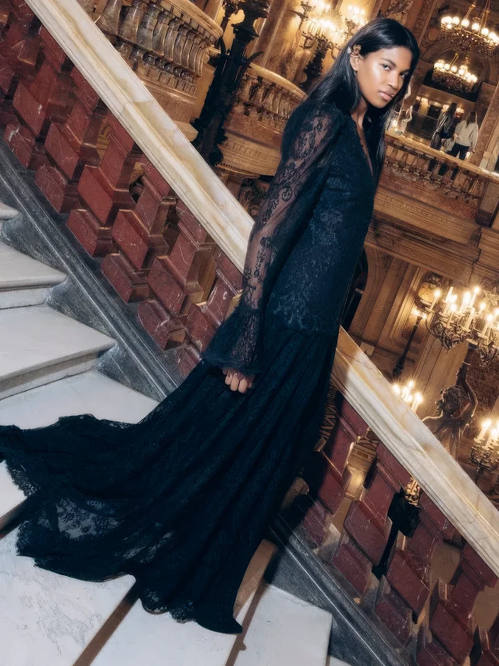 Black Chantilly lace Tori Long Lace Dress with drop waist and flared cuffs, side view on model.
