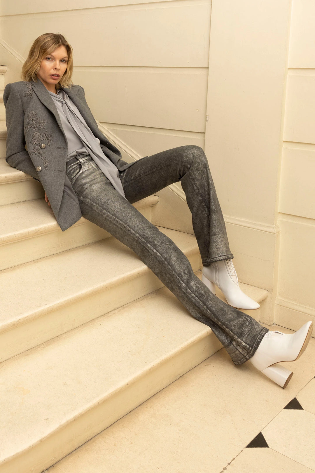 Single-breasted blazer with notched lapel, tailored fit, hand-embroidered flannel; front view on model.